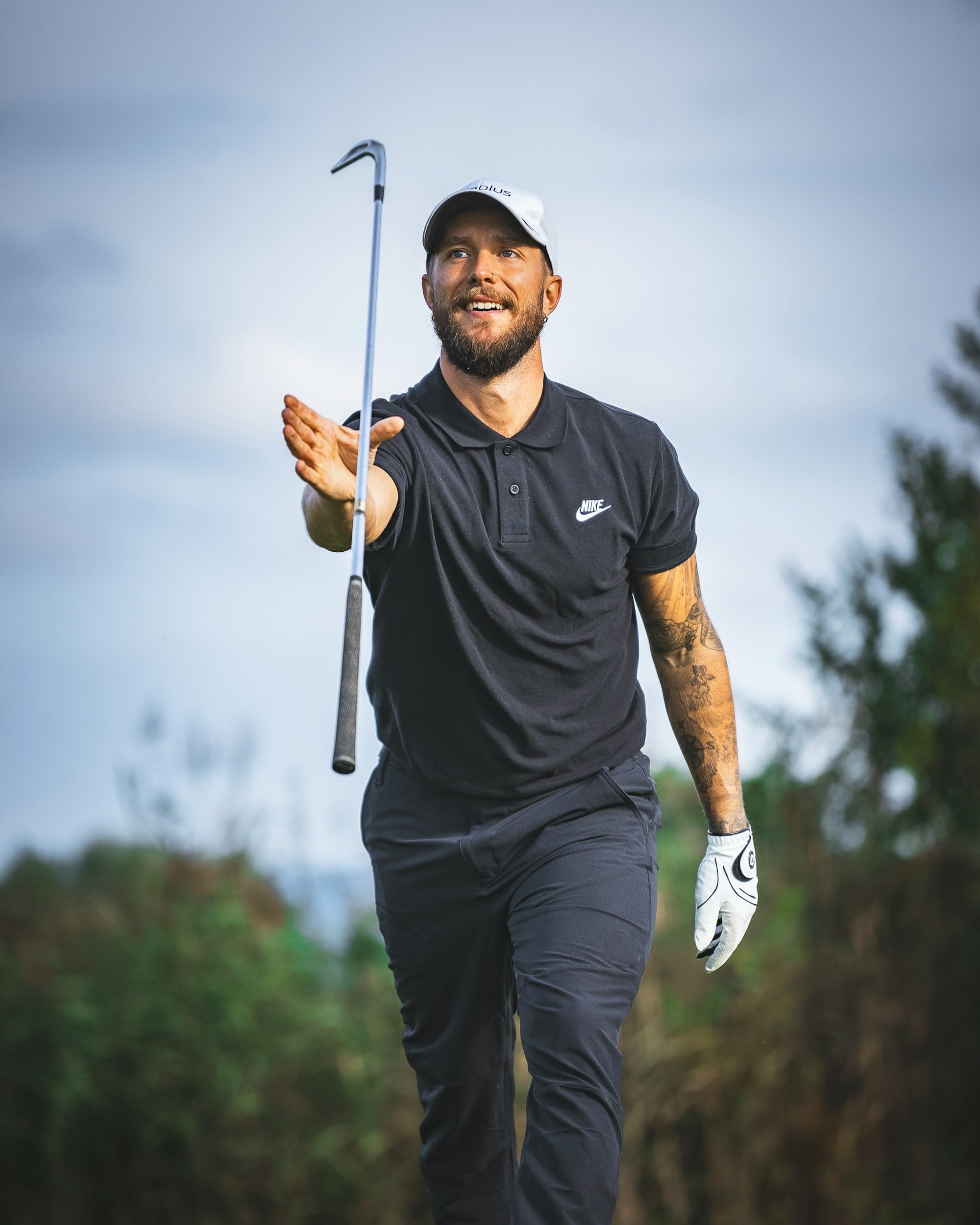 A Man Holding Golf Bat